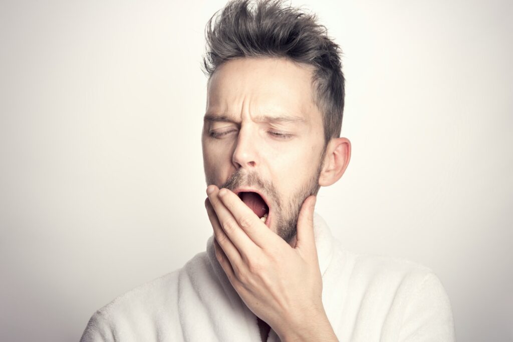 sleep facts: man yawning